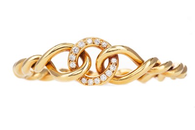 Lot 801 - A FOURTEEN CARAT GOLD DIAMOND SET BANGLE