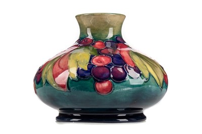 Lot 493 - A MOORCROFT LEAF AND BERRY PATTERN VASE