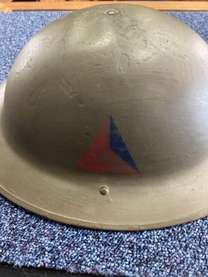 Lot 27 - A BRITISH ARMY IN NORTHERN IRELAND INERT RUBBER BULLET ROUND, AND A BRODIE HELMET