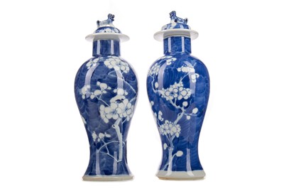 Lot 1343 - A NEAR PAIR OF CHINESE BLUE AND WHITE VASES WITH COVERS