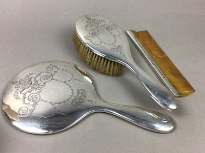 Lot 497 - A SILVER MOUNTED BRUSH, MIRROR AND COMB AND A PLATED CAKE BASKET