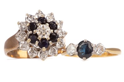 Lot 458 - A SAPPHIRE AND DIAMOND THREE STONE RING AND A CLUSTER RING