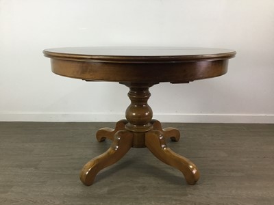 Lot 324 - A CHERRYWOOD EXTENDING CIRCULAR DINING TABLE AND EIGHT CHAIRS