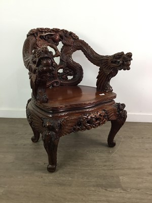 Lot 1345 - A SOUTH-EAST ASIAN CARVED AND STAINED HARDWOOD ARMCHAIR