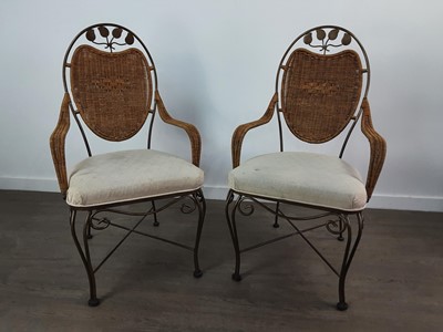 Lot 514 - A PAIR OF IRON AND RATTAN FRAMED ELBOW CHAIRS