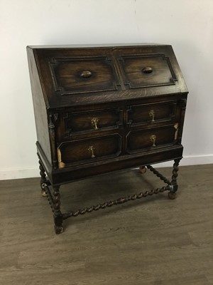 Lot 582 - AN OAK BUREAU OF CAROLEAN DESIGN