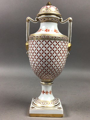 Lot 639 - A CONTINENTAL TWO HANDLED LIDDED URN SHAPED VASE WITH COVER AND A GERMAN LIDDED POT POURRI