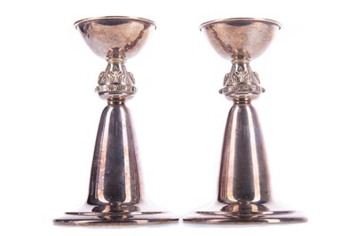 Lot 240 - A PAIR OF CELTIC REVIVAL SILVER CANDLESTICKS