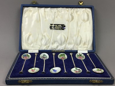 Lot 75 - A SET OF EIGHT SILVER AND ENAMEL COFFEE SPOONS