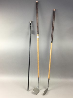 Lot 77 - A LOT OF TWO HILLERICH & BRADSBY HICKORY SHAFTED GOLF CLUBS AND A CANE