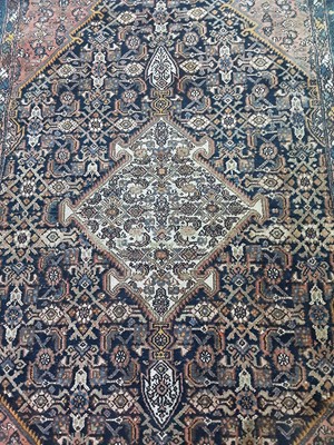 Lot 94 - A PERSIAN RUG ALONG WITH THREE SMALLER RUGS