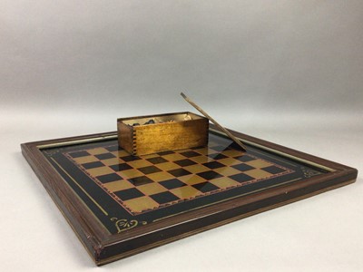 Lot 132 - A LARGE CHESS BOARD AND PIECES