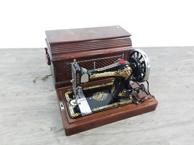 Lot 207 - A SINGER SEWING MACHINE IN CASE