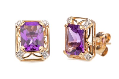 Lot 485 - A PAIR OF AMETHYST AND DIAMOND EARRINGS