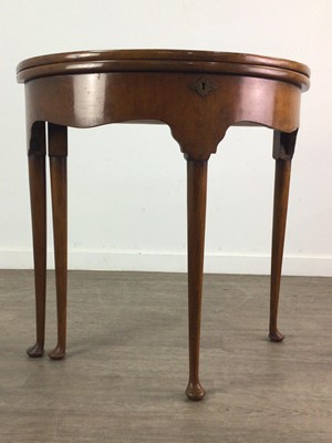 Lot 222 - A WALNUT TURNOVER CARD TABLE