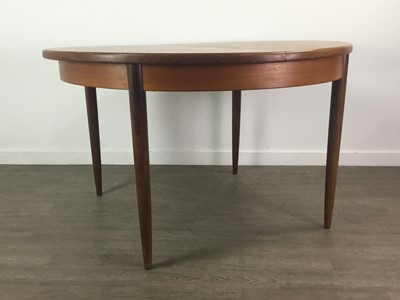 Lot 238 - A G-PLAN TEAK CIRCULAR EXTENDING DINING TABLE AND FOUR CHAIRS