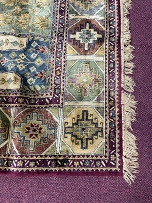 Lot 378 - A LARGE FRINGED CARPET