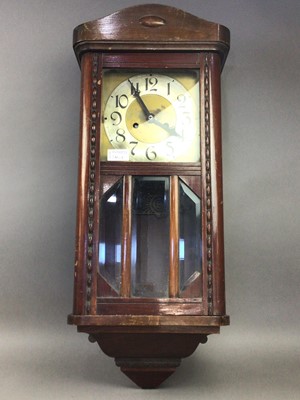 Lot 260 - A MAHOGANY WALL CLOCK AND A CHEST