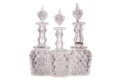 Lot 789 - A SET OF THREE MID VICTORIAN CUT GLASS DECANTERS