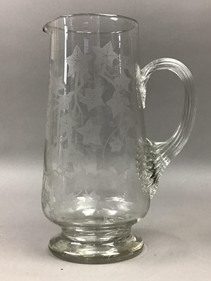 Lot 536 - A VICTORIAN GLASS WATER JUG AND A CRYSTAL JUG