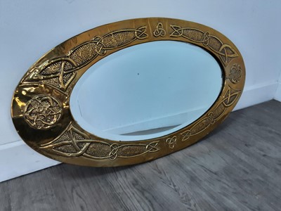 Lot 790 - A SCOTTISH SCHOOL ARTS & CRAFTS BRASS OVAL MIRROR