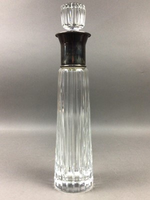 Lot 594 - A CRYSTAL LIQUOR DECANTER WITH SILVER PLATED TOP