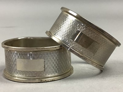 Lot 582 - TWO PAIRS OF SILVER NAPKIN RINGS AND A SILVER VANITY SET