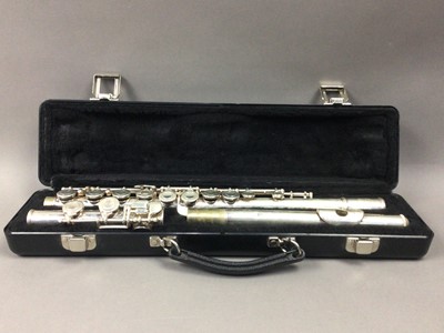 Lot 62 - A BUESCHER FLUTE IN CASE AND A STAND