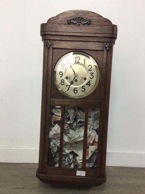 Lot 63 - AN ART DECO OAK CASED WALL CLOCK