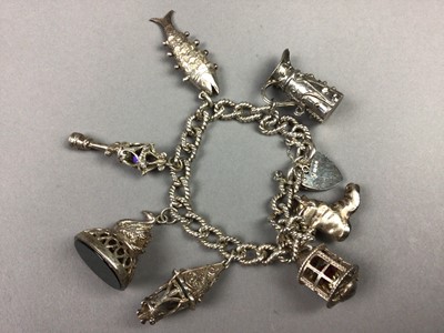 Lot 7 - A SILVER CHARM BRACELET AND BROOCH