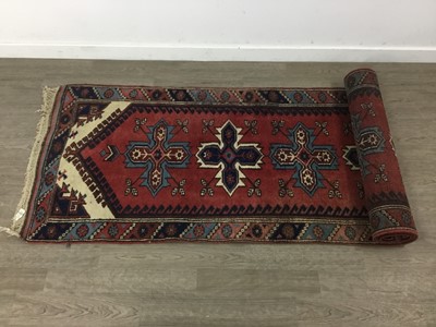 Lot 21 - A PERSIAN RUNNER