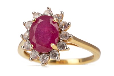 Lot 579 - A RUBY AND GEM SET RING