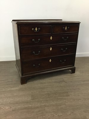 Lot 210 - A MAHOGANY CHEST OF DRAWERS AND AN OVAL DRESSING GLASS