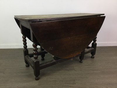 Lot 209 - AN OAK GATE LEG DINING TABLE