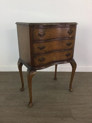 Lot 237 - A WALNUT SERPENTINE FRONTED BEDSIDE CHEST