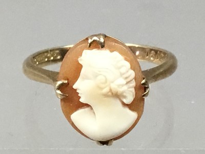 Lot 377 - A GOLD CAMEO DRESS RING, ALONG WITH AN EIGHTEEN CARAT GOLD WEDDING RING