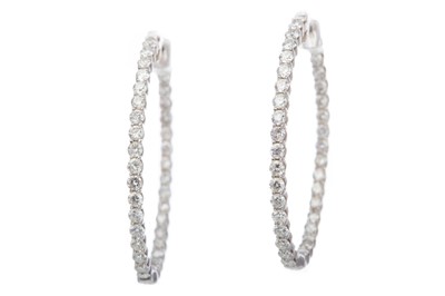 Lot 449 - A PAIR OF DIAMOND HOOP EARRINGS