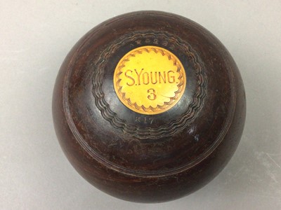 Lot 467 - A SET OF FOUR LAWN BOWLS AND TOOLS