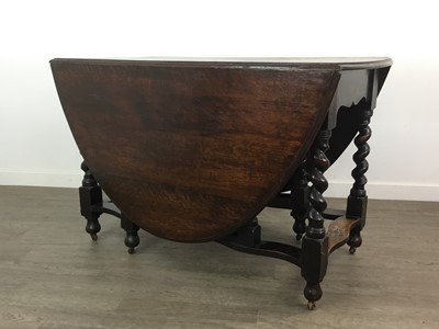 Lot 267 - AN OAK DROP LEAF TABLE