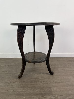 Lot 585 - A CARVED CIRCULAR TWO TIER OCCASIONAL TABLE