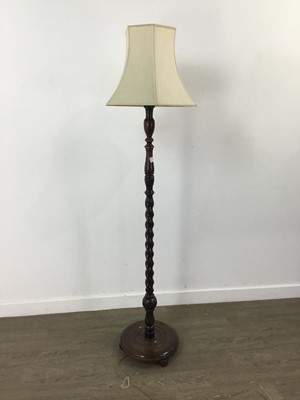 Lot 554 - AN OAK FLOOR LAMP