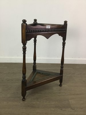 Lot 553 - AN OAK STICK STAND