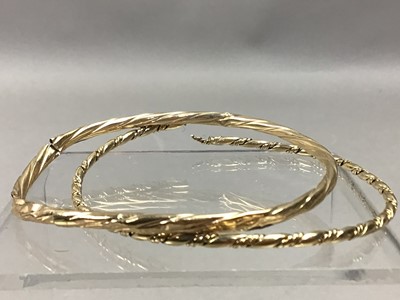 Lot 499 - A NINE CARAT GOLD BANGLE AND ANOTHER