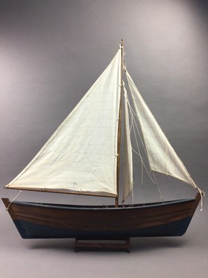 Lot 593 - A WOODEN MODEL OF A SAILING BOAT