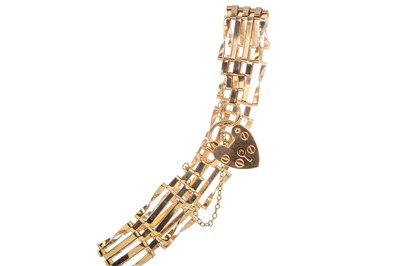 Lot 456 - A NINE CARAT GOLD GATELINK BRACELET