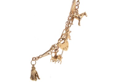 Lot 458 - A GOLD CHARM BRACELET