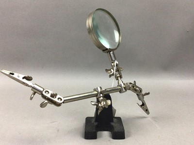 Lot 620 - A BRASS MAGNIFYING GLASS ON STAND AND ANOTHER