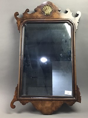 Lot 327 - A WALNUT WALL MIRROR