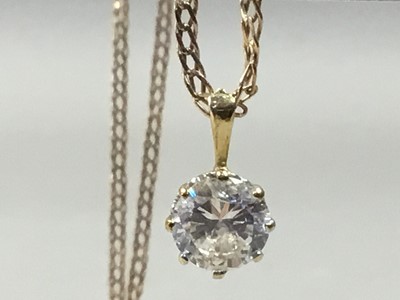 Lot 16 - A ZIRCON PENDANT ON A FINE NINE CARAT GOLD NECKCHAIN AND ANOTHER GOLD NECKCHAIN