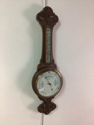 Lot 205A - AN EARLY 20TH CENTURY CARVED OAK BANJO BAROMETER